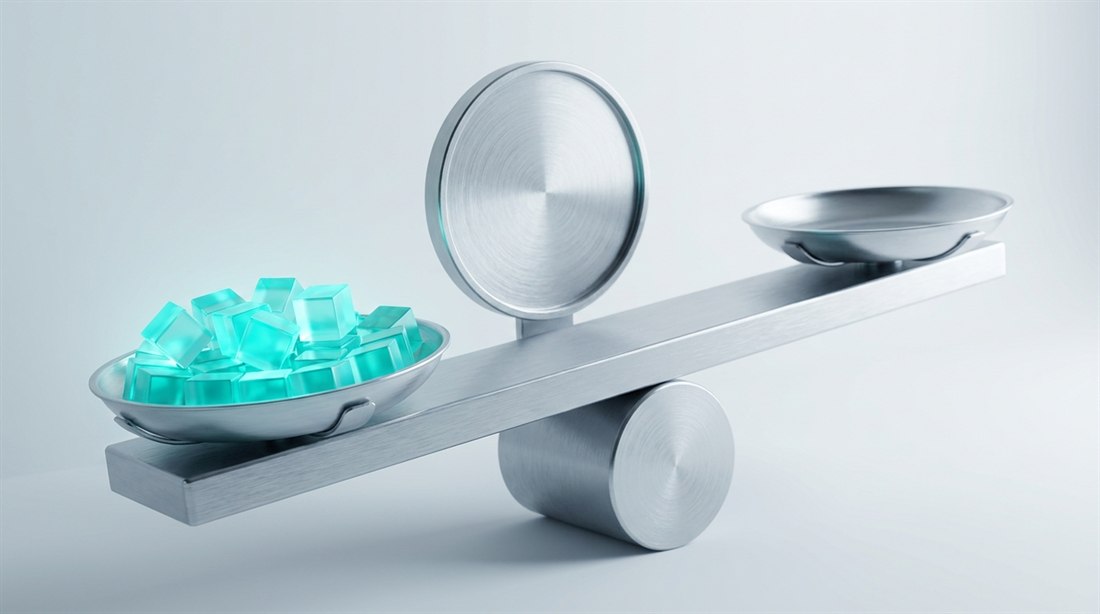 A brushed aluminum balance beam, one pan heaped with glowing cyan blocks and the other empty, behind it a gauge face with no markings at all